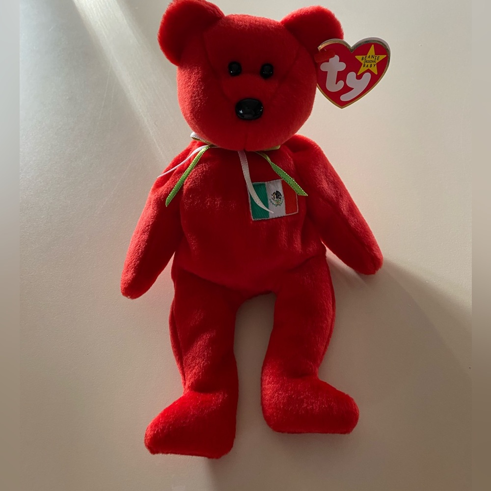 NWT BEANIE BABY - “Osito” the Italian bear, kept in collectible case.